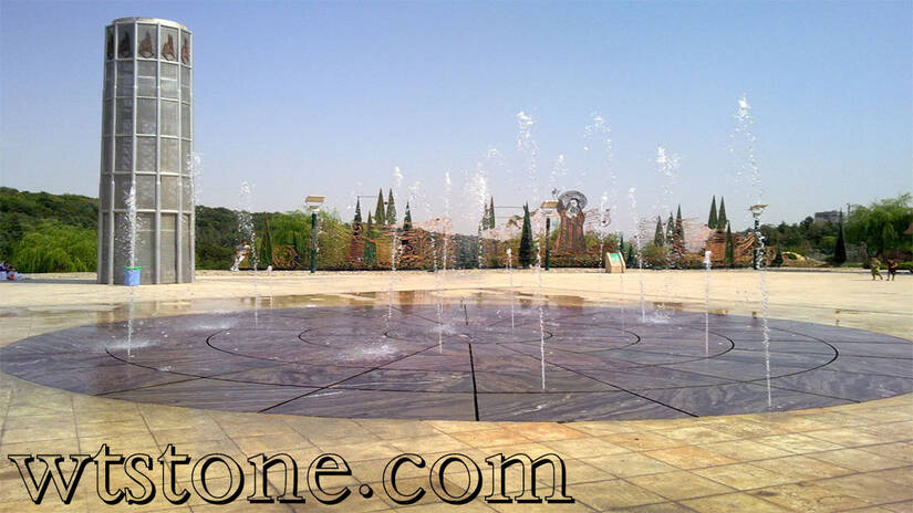 سنگ گندمک تیشه ای در آبنمای پارک آب و آتش تهران